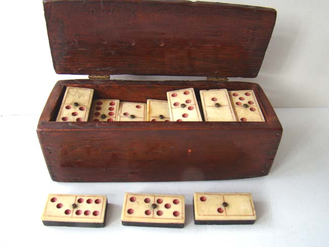 An early 19th century boxed set of bone dominoes with red dots circa 1825. — image 2